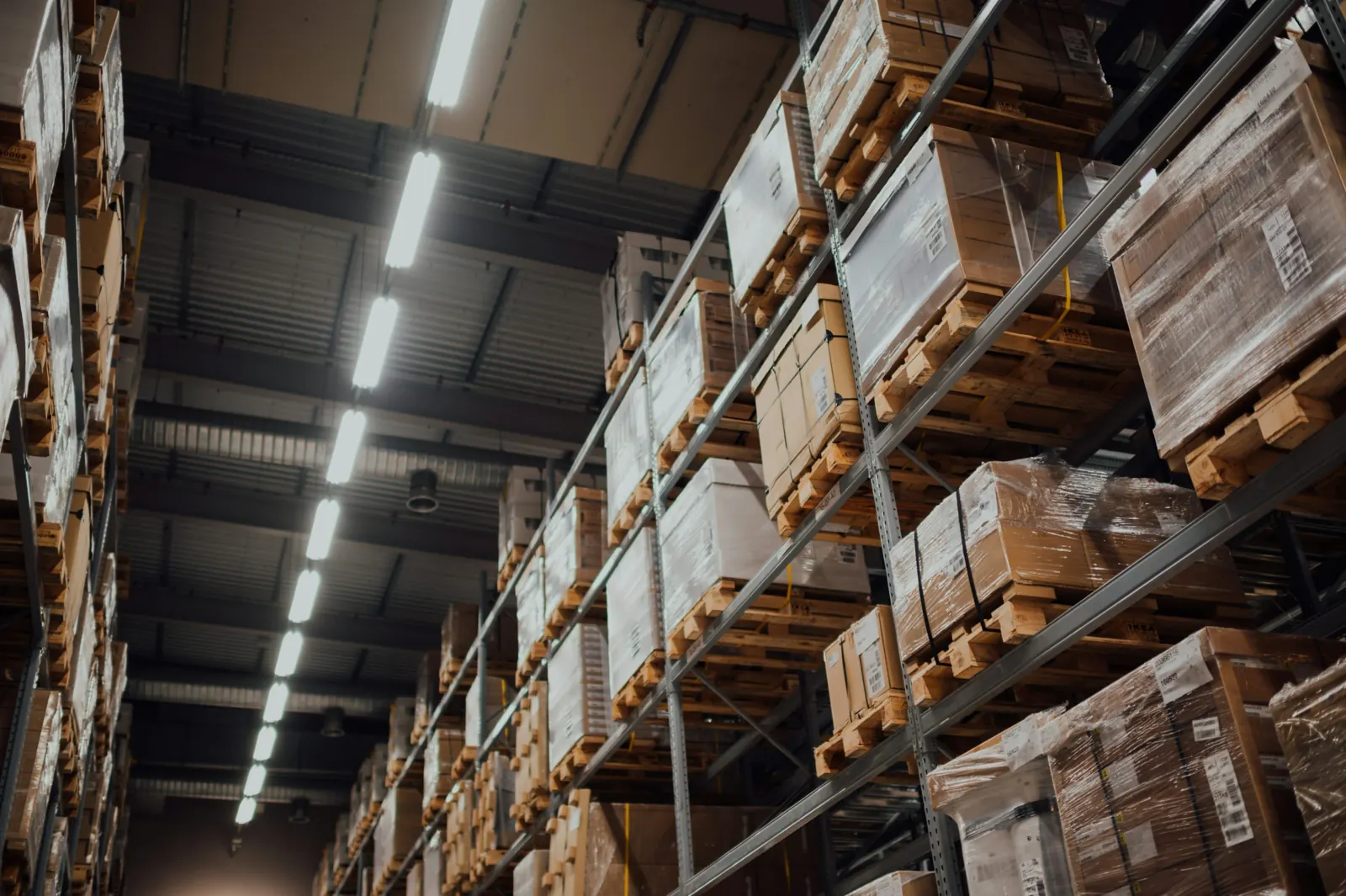 Cardboard cartons stored on tall warehouse racks